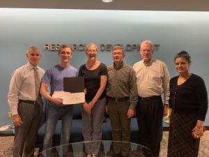 Matthew Eason received second prize in the 2024 Graduate Translational Research Award competition. Phil Robilotto, Dr. Cowger, Dr. Purnell, Robert McCarthy, JD, PhD, and Rana Quraishi, PhD (left to right) presented him with an award certificate.